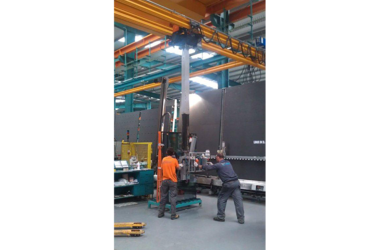 Crane operators use crane as hoist to lift glass 