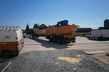 Overhead travelling crane with trolley on the way to the warehouse of components of the company ENERCON in France