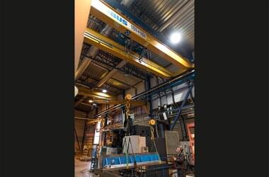 Active double girder travelling crane in production hall of Konepaja Enne Oy in Finland