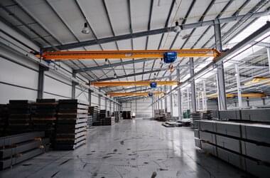 Single girder travelling cranes in warehouse of MFO company in Poland