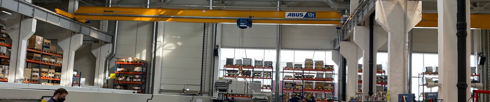 ABUS single girder travelling crane operating in warehouse of Caljan in Latvia