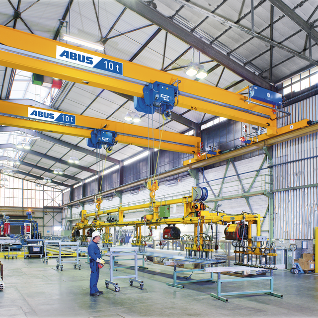ABUS employee operates ABUS double girder overhead travelling crane with ABURemote handheld transmitter 